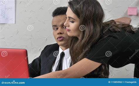 Young Woman Boss Seduces Her African Employee Sexually Leans Flirting