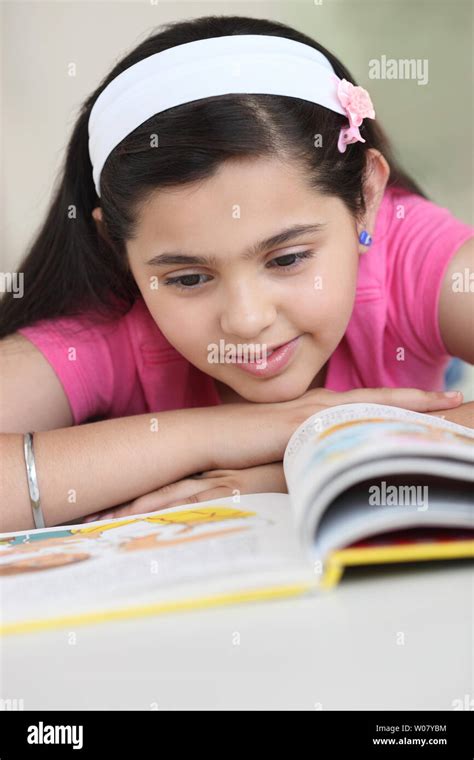 Indian Girl Reading A Book Stock Photo Alamy