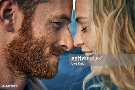 Young Couple Embracing Rubbing Noses Together Closeup Photo Getty Images