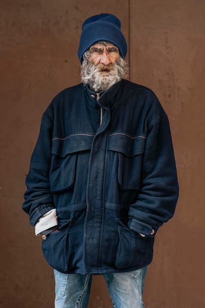 Free Photo Front View Of Homeless Man With Warm Jacket