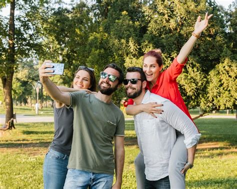 Free Photo Group Of Joyful Adult Friends Taking Selfie Together