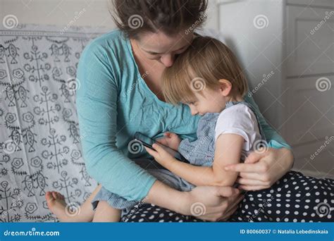 Pregnant Mom And Son Toddler Playing With Phone Lifestyle Rea Stock