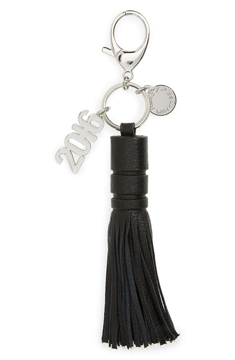 As your son graduates from high school, he's also graduating into the proud male tradition of getting the exact same gifts every year: Rebecca Minkoff Graduation Bag Charm | Nordstrom