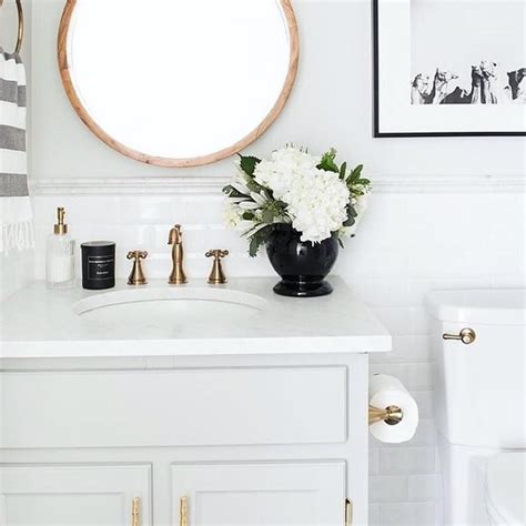 The lighting arrangement in a bathroom is extremely important, and a flush mount ceiling light is part of the perfect bathroom lighting installation. #Repost @deltafaucet A Champagne Bronze Cassidy Faucet ...