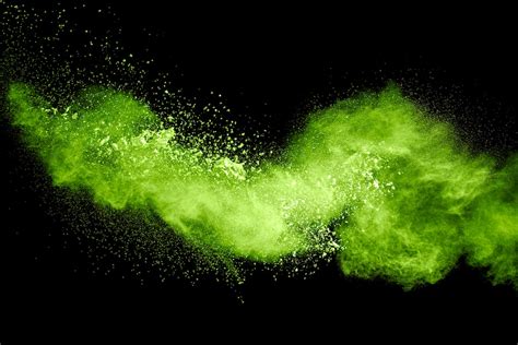 Premium Photo Green Yellow Dust Particles Explosion On Black