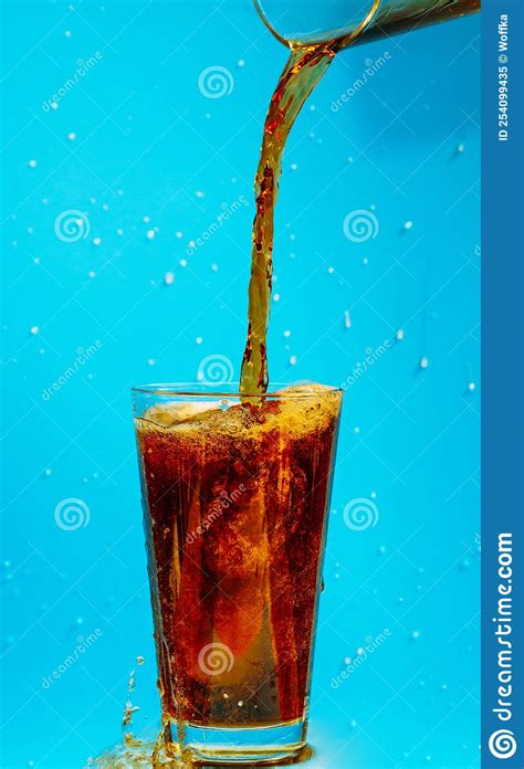 Cola Is Poured Into A Glass Splashing Around Stock Image Image Of