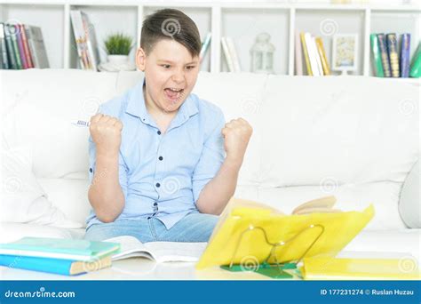 Portrait Of Boy Doing Homework At Home Stock Photo Image Of Smart
