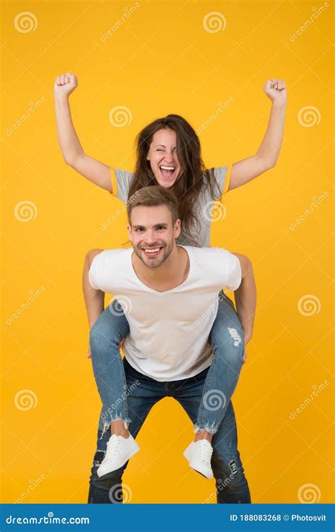 Solid Support Cheerful Man Piggybacking His Girlfriend Hipster Giving