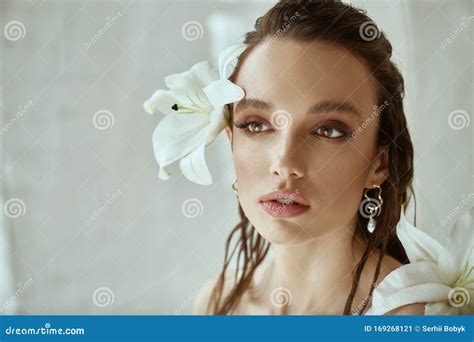 portrait of girl with lily flower behind ear stock image image of hair aroma 169268121