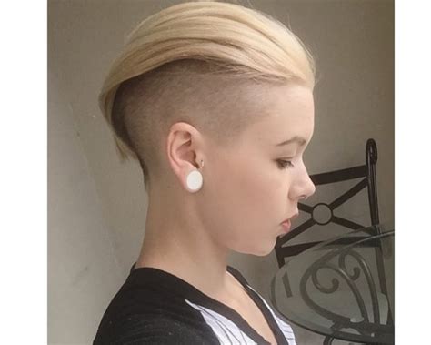 Short Pixie Blond Hairstyle With Shaved Sides And Swept Back Fringe