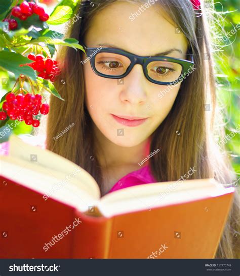 Cute Teenage Girl Reading Book While Stock Photo 157170749 Shutterstock