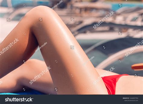 Sexy Suntan Bikini Woman Legs Relaxing Stock Photo