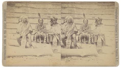 An Old Black And White Photo Of Native American Men Sitting On Steps