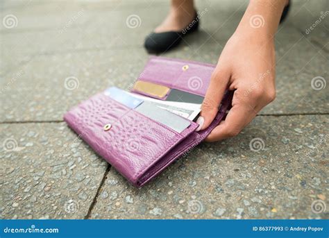 Woman Picking Up Fallen Wallet Stock Image Image Of Female Debit
