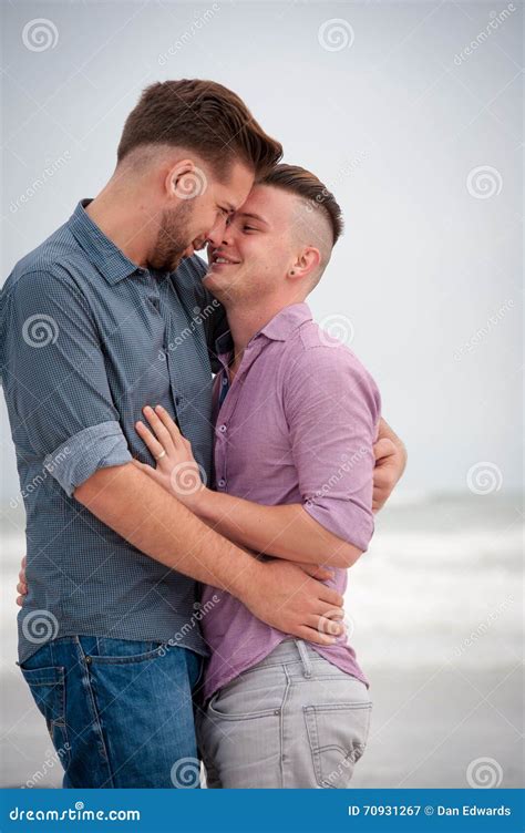 Gay Men Embracing On A Beach Stock Image Image Of Embracing Modern