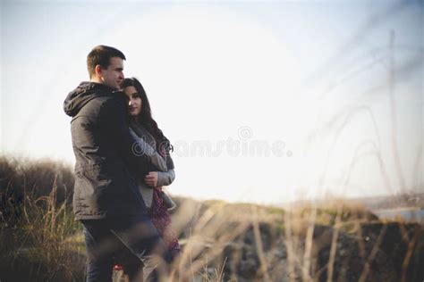 Husband And Wife In Nature Early Spring Happy Couple On Vacation Lovers Are Laughing Guy And