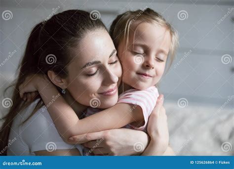 Close Up Of Young Mom Hugging Cute Little Daughter Stock Photo Image