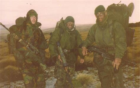 Royal Marine Snipers And A Gpmg Gunner Prior To The Assault On Mount