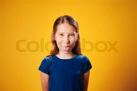 Young Redhead Preteen Girl Showing Tongue To Camera Stock Image Colourbox