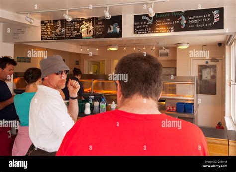 People queue inside The Golden Galleon fish & chip shop in Aldeburgh