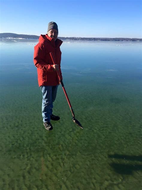 Photo Of Northern Michigan Man Standing On Clear Ice Goes Viral