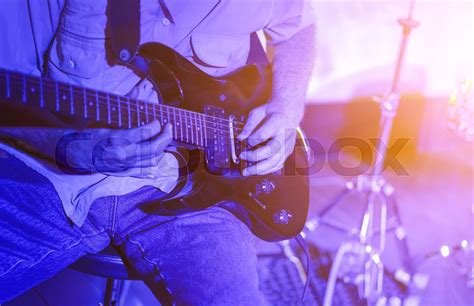 Man Playing The Guitar On Stage Closeup Stock Image Colourbox