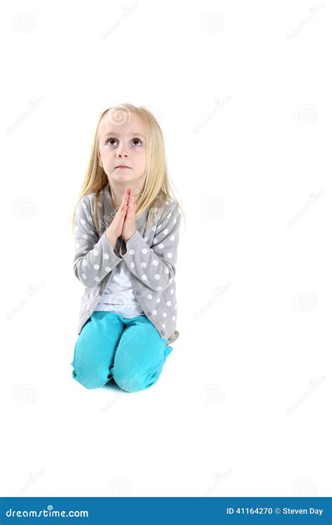 Adorable Young Girl Kneeling In Prayer Looking Up Stock Photo Image