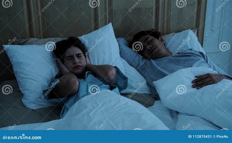 The Pretty Woman Cannot Sleep Because Of Husband Snoring Stock Image