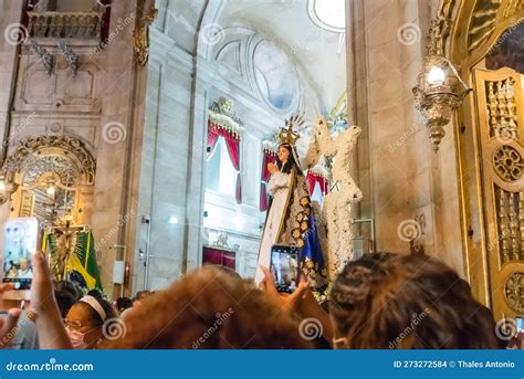 hundreds of faithful are praying at the mass in honor of nossa senhora da conceicao da praia