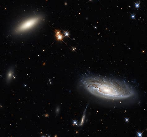 Hubble Captures Two Gargantuan Galaxies In The Perseus Galaxy Cluster