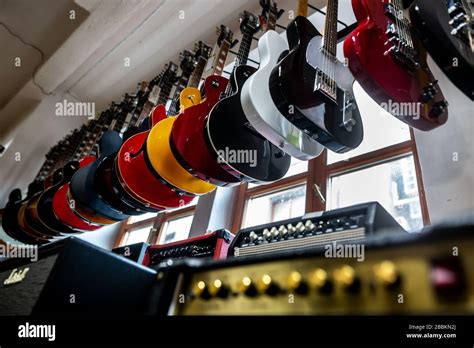 Huge Arrenge Of Professional Electric Guitars Draped In A Row In A Shop