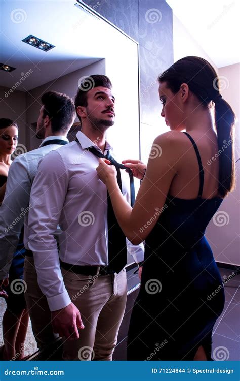 A Young Couple Getting Dressed In The Changing Room Stock Photo Image