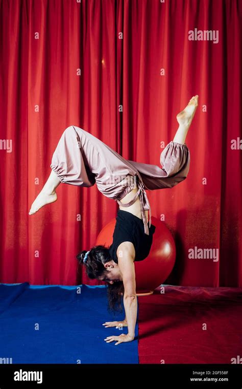 Female Acrobat Doing Handstand On Circus Stage Stock Photo Alamy