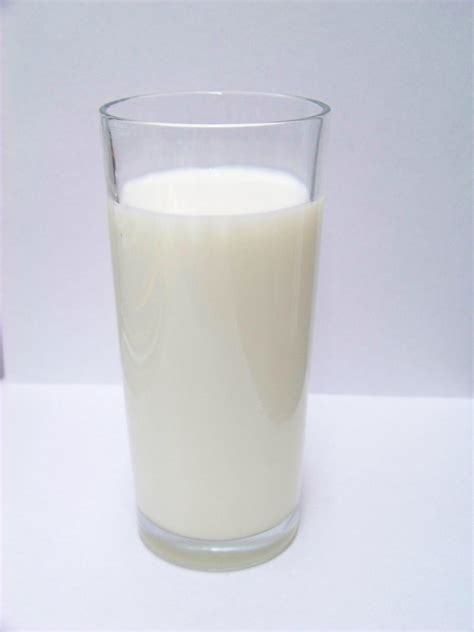 White ceramic container with milk illustration, raw milk splash graphy, a glass of milk poured out, glass, wine glass png. What You Should Not Eat And Drink After 8 PM