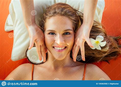 Close Up Woman On Resort Getting Face Spa Treatment Lying On A Massage