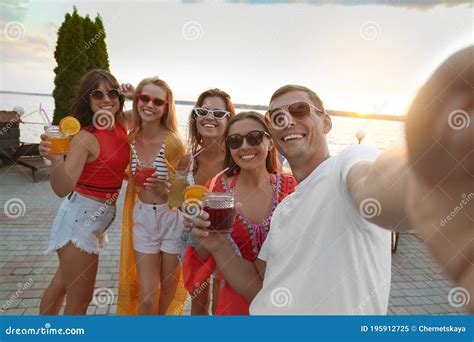Happy People With Refreshing Drinks Taking Selfie At Party Outdoors Stock Image Image Of