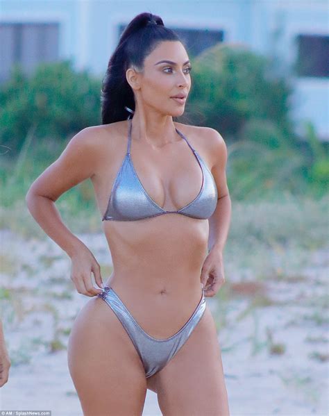 Kim Kardashian Wears Sexy Silver Suit As She Poses Away In Miami