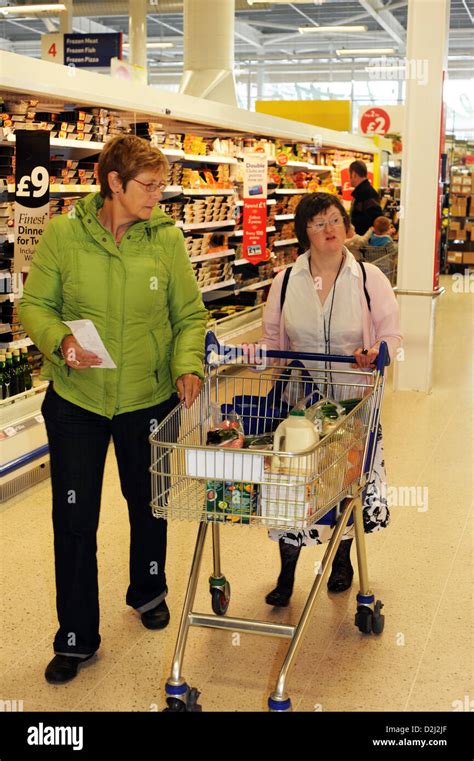 A Young Women With Learning Disabilities Go Shopping With Their Support