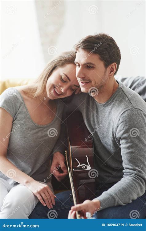 Girl Is Satisfied Playing On Acoustic Guitar For The Girlfriend In The