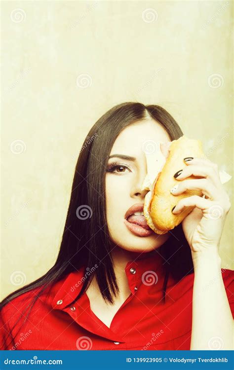 Hungry Pretty Brunette Woman Eats Big Sandwich Or Burger Stock Image