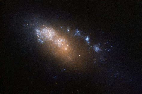 Image Hubbles Dwarf Sized Double Named Galaxy