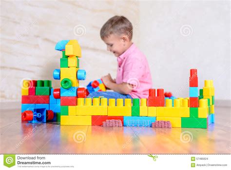 Happy Young Boy Playing With His Building Blocks Stock Photo Image Of