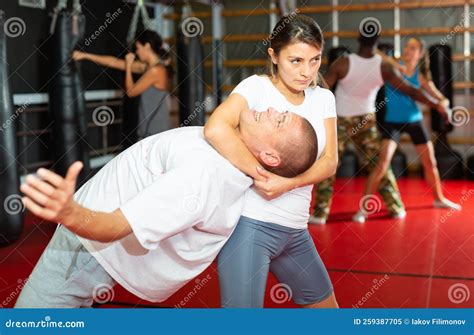 Woman Practising Neck Grabbing Move In Gym Stock Image Image Of