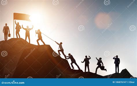 Concept Of Teamwork With Team Climbing Mountain Top Stock Image Image