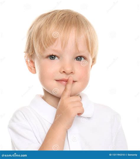 Cute Little Boy Showing Silence Gesture On White Background Stock Photo