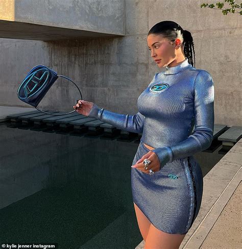 Kylie Jenner Displays Her Sexy Curves In A Metallic Blue Ribbed Top And Miniskirt While On
