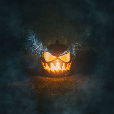 Premium Photo Halloween Pumpkin Smiling Seeing Teeth With Smoke On