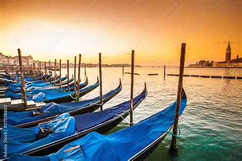 Gondolas Moored By Saint Mark Square Venice During Sunrise Italy