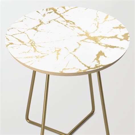 A White And Gold Marble Side Table With Metal Legs On An Isolated