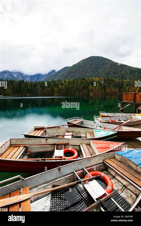 Alpine Landscape And Colorful Boats Near Slovenian Italy Border Lake